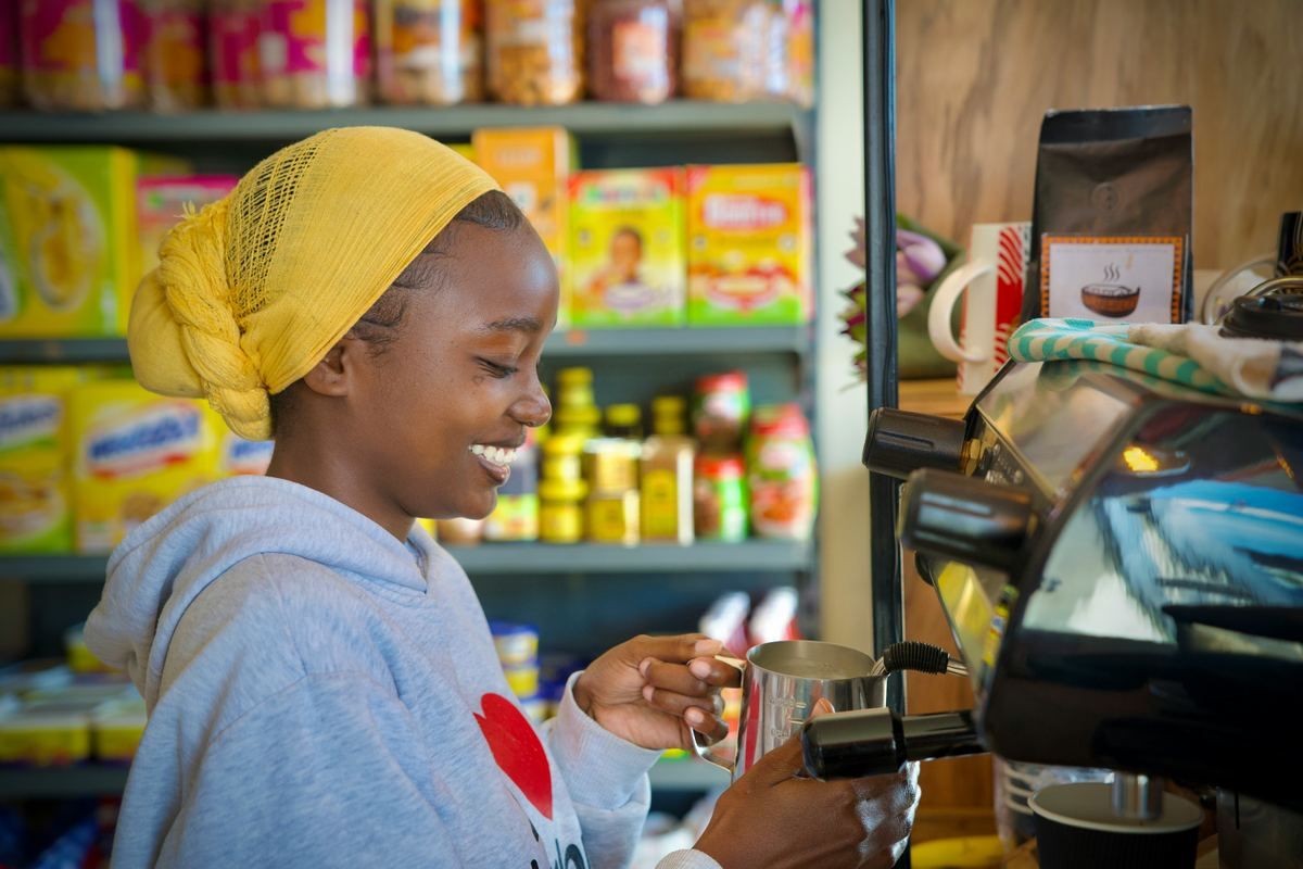 A shopkeeper serving a customer